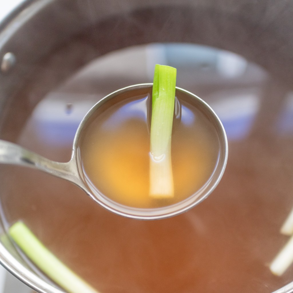 Vegetable stock with green onion for vegetarian and vegan pho (phở chay)