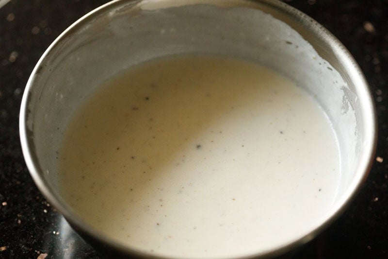 mixed and prepared yogurt-lemon sauce in bowl.
