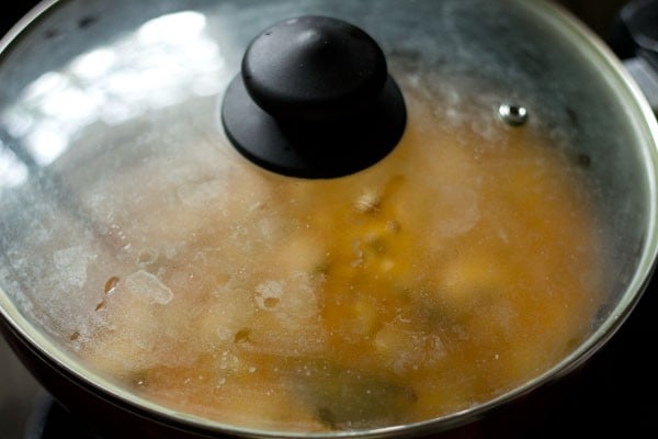 Pan covered with a glass lid.