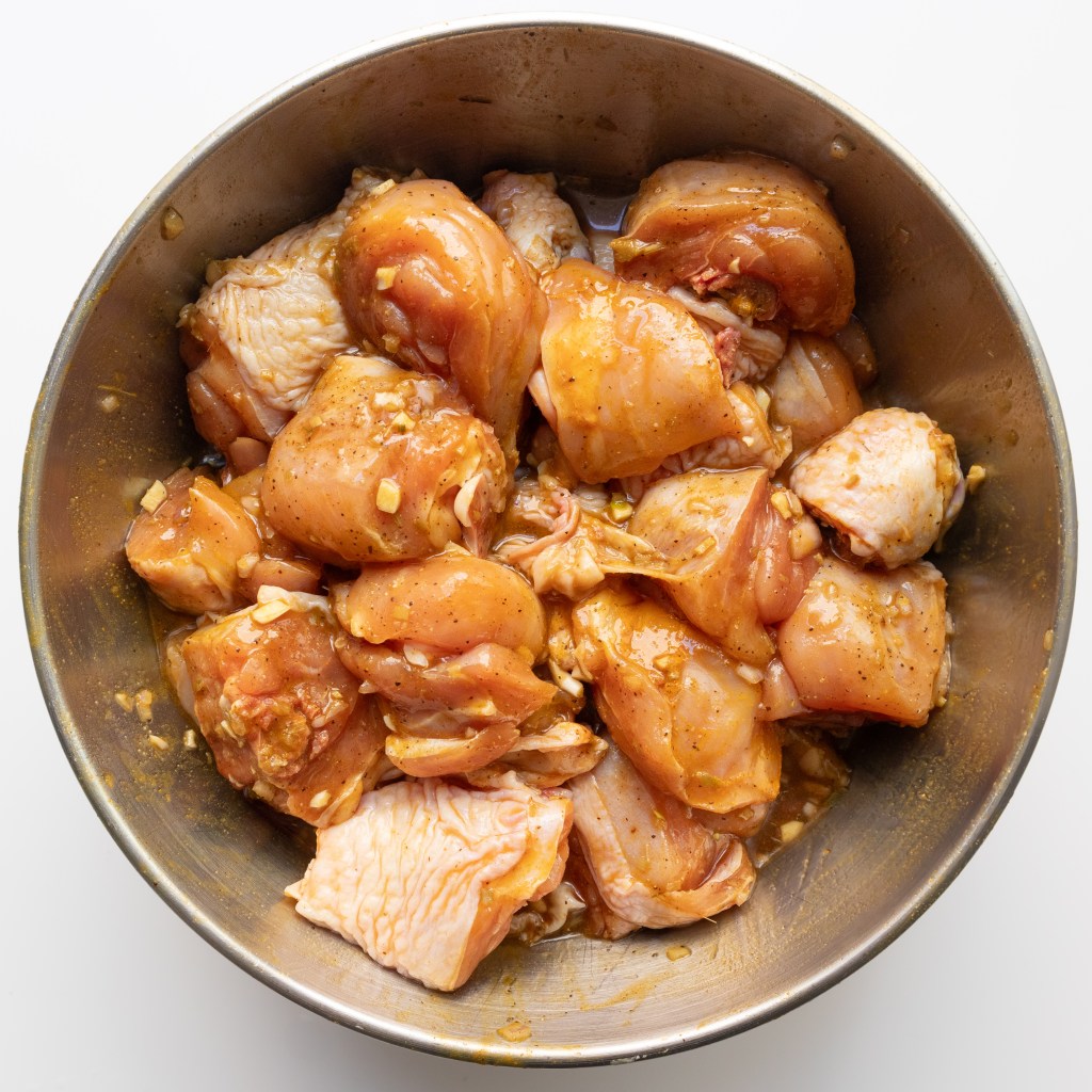 Marinating chicken for Vietnamese braised turmeric lemongrass chicken (Gà Kho Nghệ Sả)
