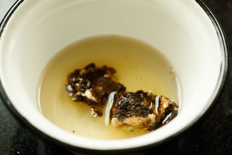 Soaking tamarind in hot water.