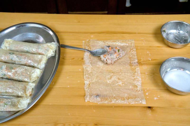 Wrapping the fried shrimp rolls