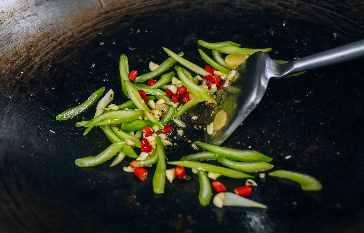 stir-frying celery with chilies and garlic