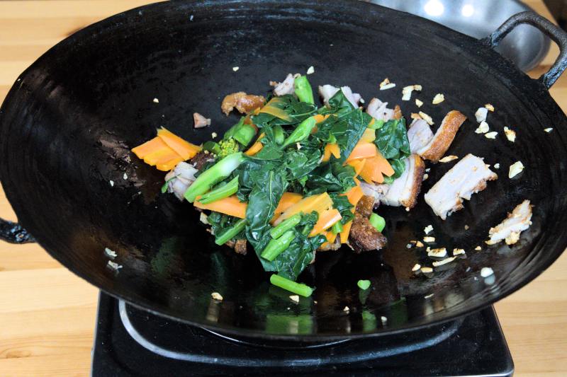 Stir fry the roast pork with gai lan and the chopped garlic.