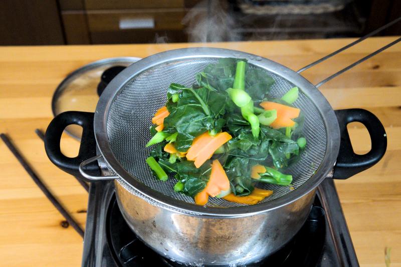 Blanch the vegetables until tender.