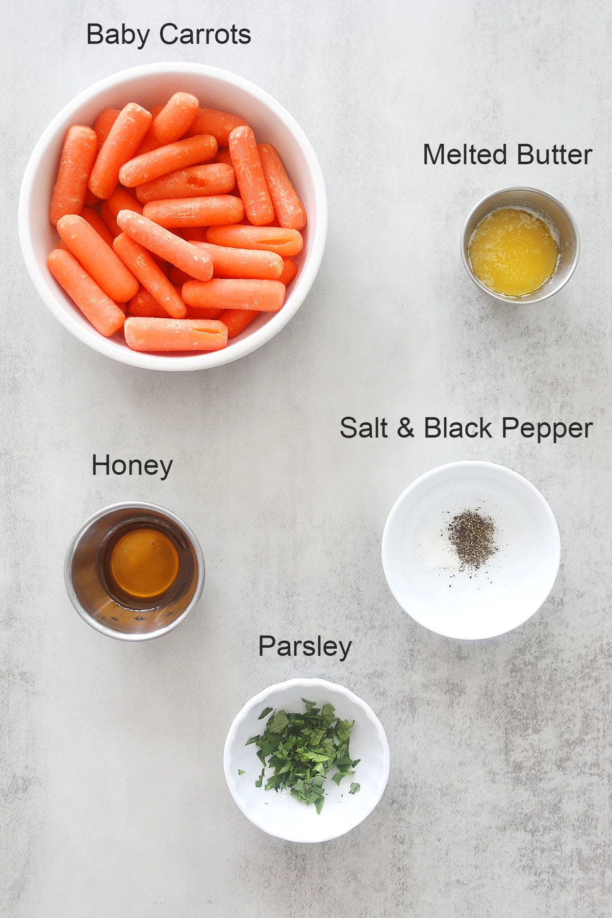 Ingredients for air fryer honey butter carrots.