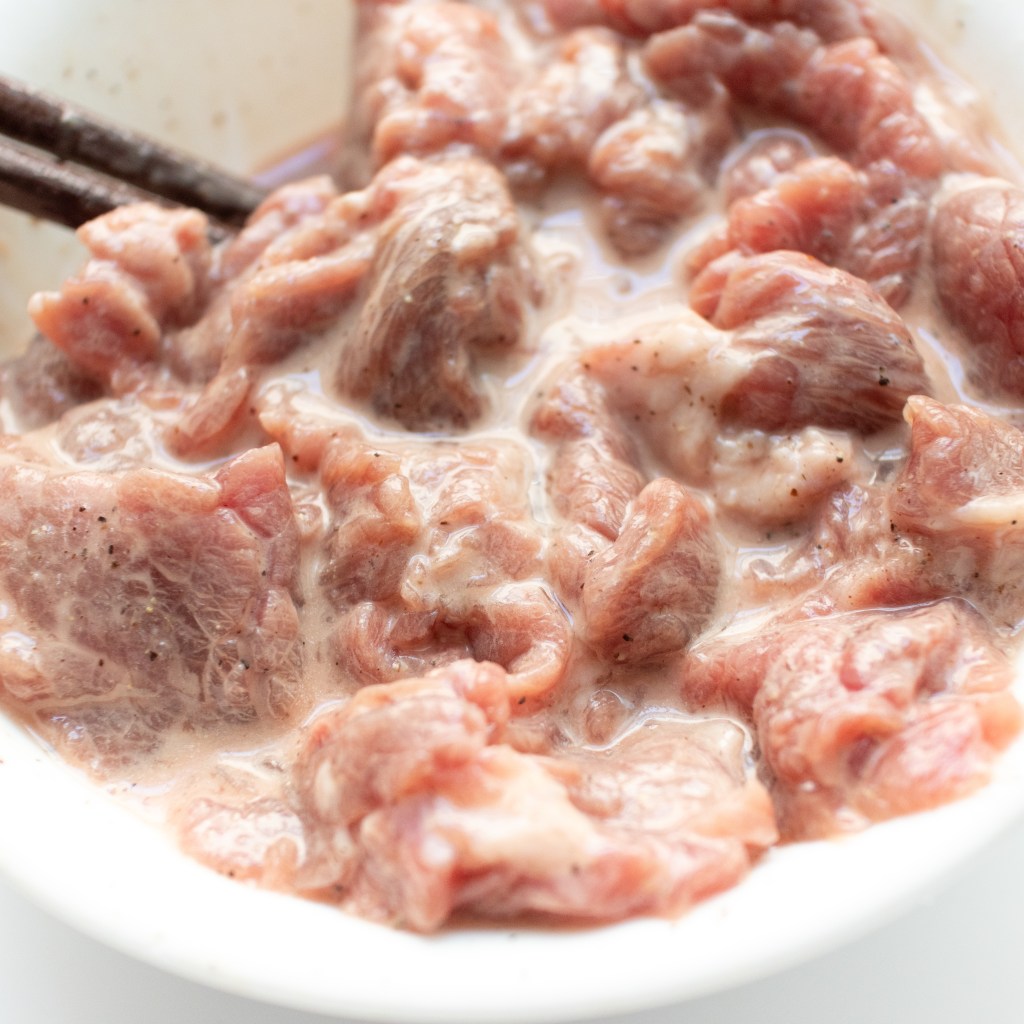 Marinate beef with seasonings, water and baking soda