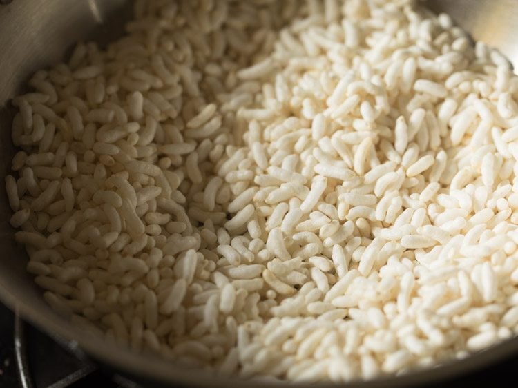 Checking roasted puffed rice.