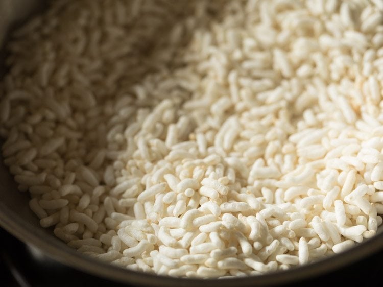 Puffed rice added to hot pan.