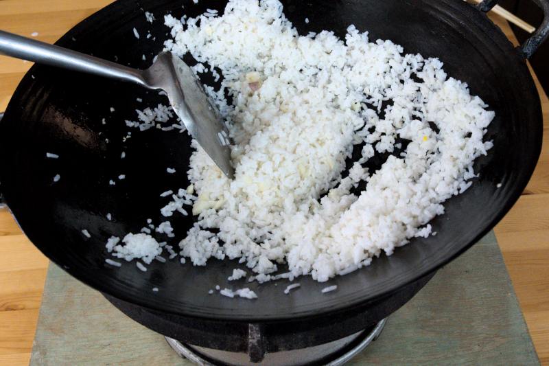 fry the rice over high heat until fragrant