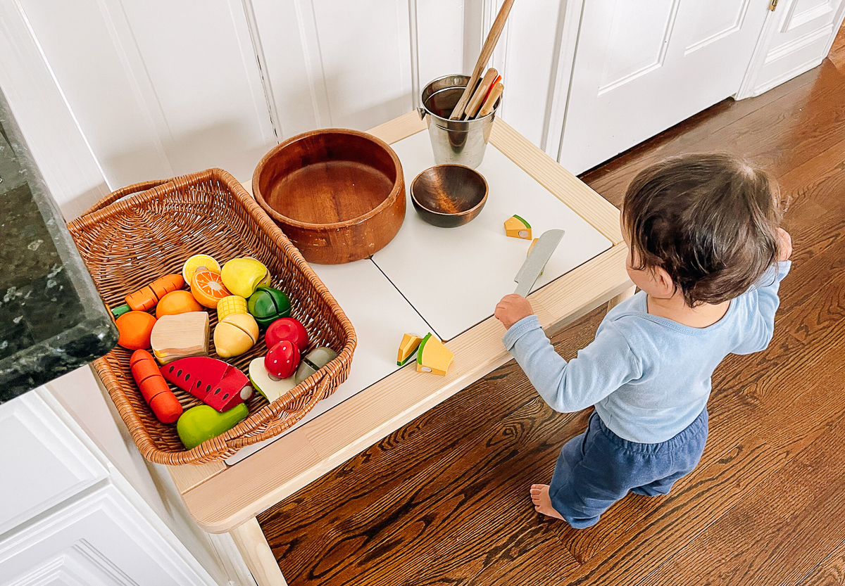 Ethan playing kitchen
