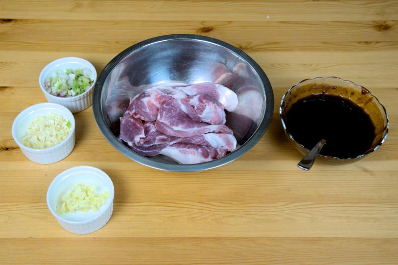 Marinate the pork with Char Siu sauce, ginger, garlic, and scallion
